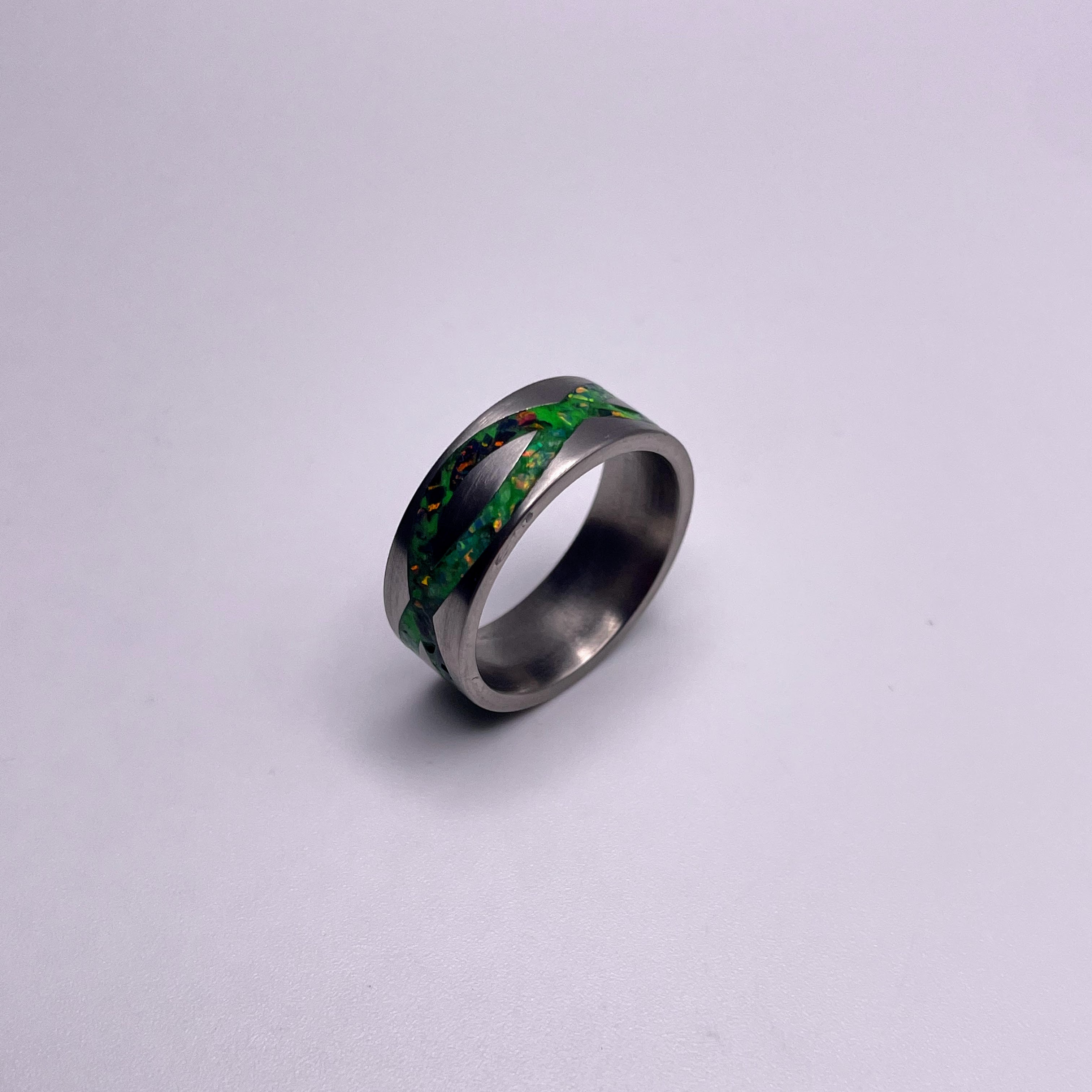 Galaxy opal ring. Black ceramic glow ring with forest green opal and j –  Orth Custom Rings